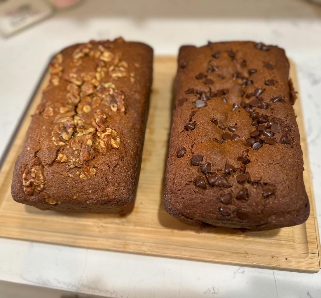 Walnut and Nutella banana bread loaves on a cutting board